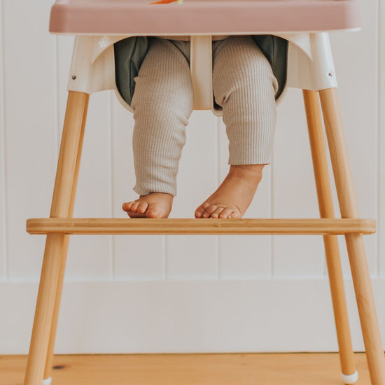 IKEA High Chair Foot Rest with child in highchair