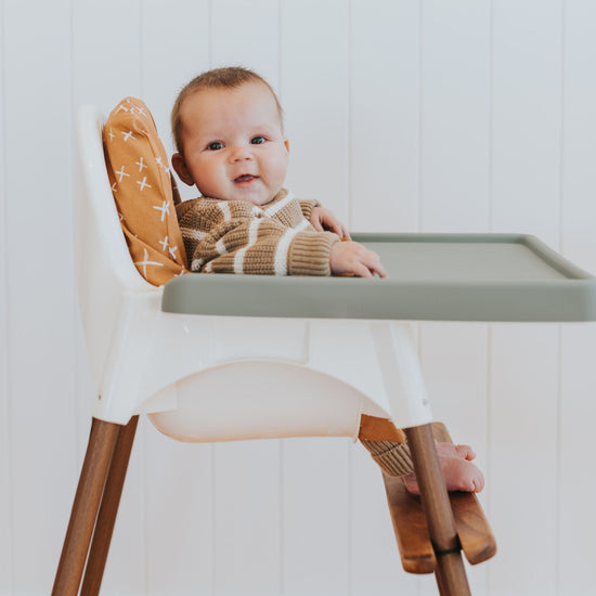 IKEA Highchair Footrest in Walnut with Leg Wraps and Sage Placemat